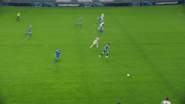 Soccer Football Match Event on Championship: White Team Attacks, Playing Pass, Kick and Miss the Gates. International Tournament. Sport Channel Broadcast Television Playback. Slow Motion Wide Shot
