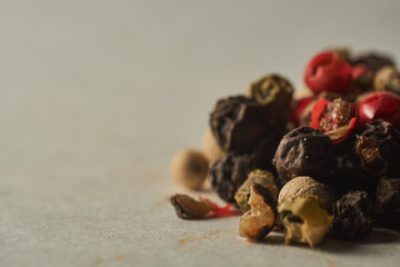 Details of a mountain of colored pepper on a white background