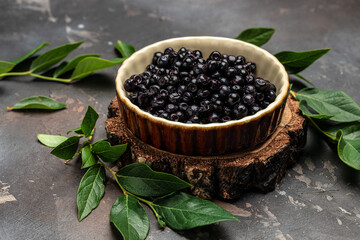 Bilberry. Superfoods antioxidant. Bowl of fresh berry on dark background, top view