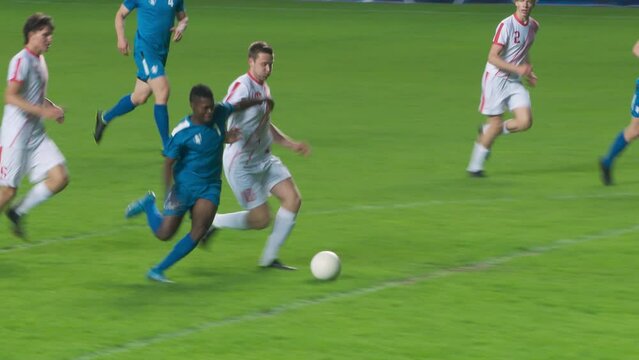 Soccer Football Match Championship: Blue Team Players Attacks, Falls when Pushed and Loses Ball to Foul. Dynamic Game on Tournament. Sport Broadcast Channel Television Playback. TV Tracking Shot