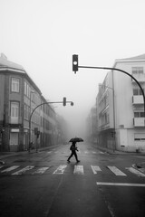 View of the foggy street in Porto, Portugal. Black and white photo.