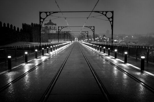 Night view of the Dom Luis I Bridge, Porto, Portugal. Black and white photo.