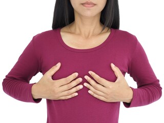 Young woman examining her breast for lumps or signs of breast cancer on white background. Closeup...
