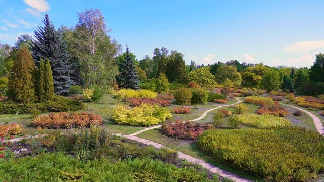 Ukraine. City of Krivoy Rog. Early autumn. Park in the botanical garden. Landscape design. No people. Panorama. The camera moves from left to right