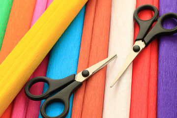 colorful crepe paper sheets and scissors