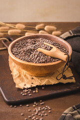 Brown lentils in a ceramic bowl