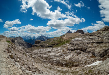 Fototapeta na wymiar Panoramic hiking trail along the Tirol Sexten mountain chain during summer time