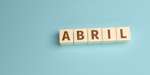 The Spanish word Abril (April) built from letters on wooden cubes. High angle view with copy space