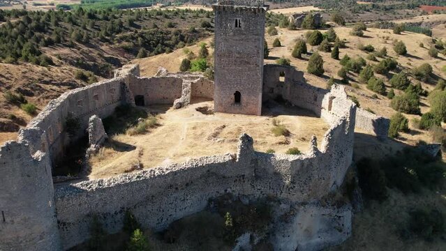 Round flght around a medieval castle in Ucero, Soria, Spain. Built top of a hill. Daylight.