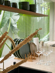 Dried decorative grass closeup with blured kitchen interior
