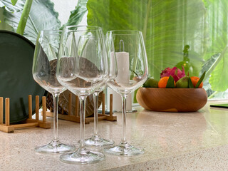 Empty wine glass on kitchen stone countertop