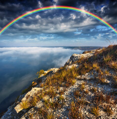 colorful rainbow over river canyon. nature of Ukraine