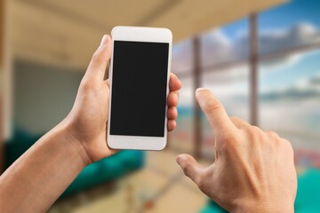User hand hold a smartphone with a blank screen