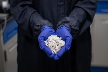 Holding White Tablets