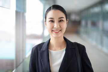 Asian business woman smiling looking camera, Fashion business photo of beautiful girl in casual suite. 