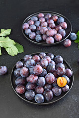 Fresh plums on plate