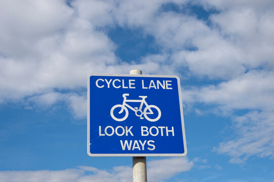 cycle lane, look both ways sign.