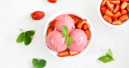 Strawberry ice cream in white bowl