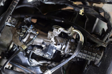 Fototapeta na wymiar Closeup of the engine injector nozzle. motorcycle engine