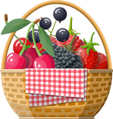 Wicker picnic basket with berries.