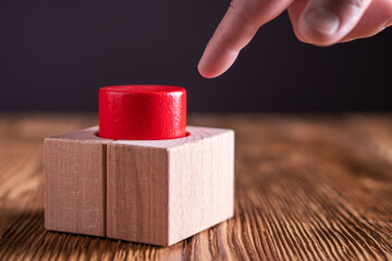 Hand press the red button.