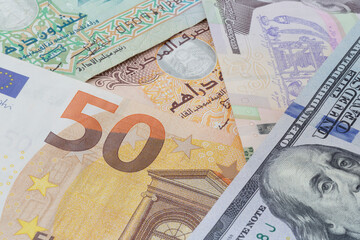 euro, US dollars, UAE dirham and Ukrainian hryvnia banknotes
