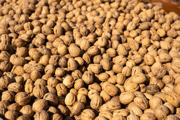 Walnuts in boxes at the bazaar close-up.