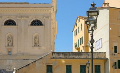 Obraz premium Ornate buildings and street lamp with deep blue mediterranean skies in Camogli, Italy.