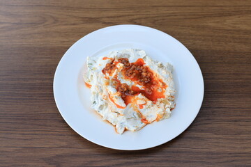 Meze or mezze is a selection of small dishes served as appetizers in much of West Asia, Middle East, and the Balkans. Meze is often served as a part of multi-course meals.