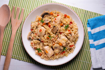 Rice paella with turkey and vegetables. Healthy recipe.