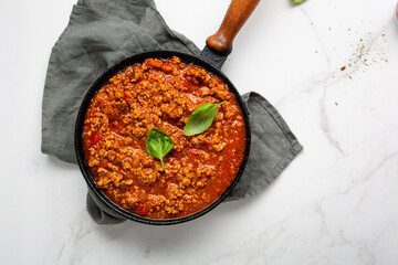 italian bolognese sauce in saucepan for pasta top view cooking food