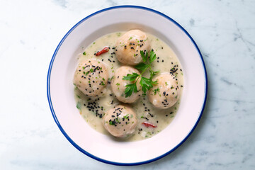 Fish meatballs with white wine sauce. Traditional tapas from Barcelona, ​​Spain.