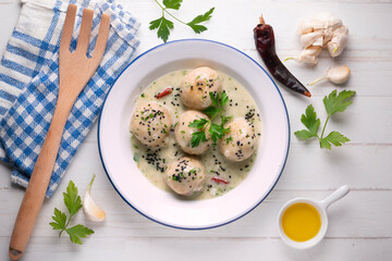 Fish meatballs with white wine sauce. Traditional tapas from Barcelona, ​​Spain.