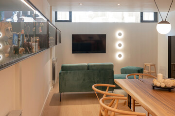 Modern basement interior design. Open space of living and dining room