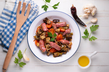 Iberian pork sausages sautéed with vegetables. Tapa typical center of Spain.