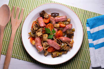 Iberian pork sausages sautéed with vegetables. Tapa typical center of Spain.