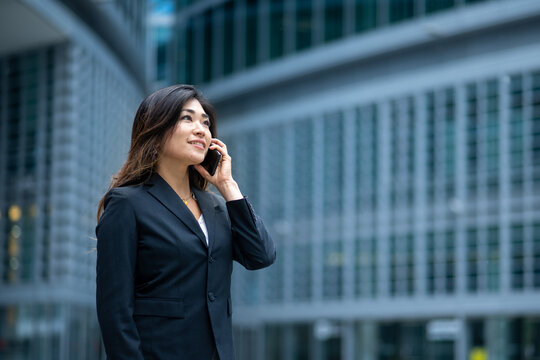 Charming And Elegant Japanese Woman Engaged In A Phone Call, Concept Of Success In Business, Ransom And Successful Entrepreneurship Of Women