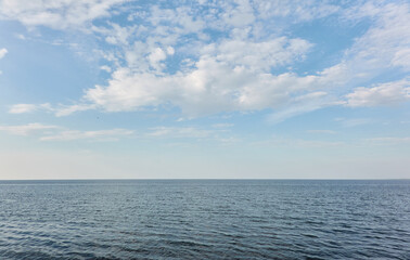 Obraz premium Baltic sea shore on a sunny day. Clear blue sky and water. Idyllic summer seascape, landscape. Pure nature, ecology, eco tourism, vacations. Panoramic view