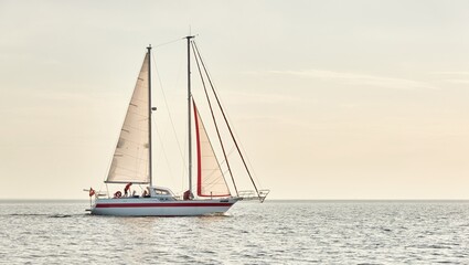 Modern two masted sailboat sailing in the Baltic sea on a clear day. Transportation, yacht cruise,...