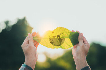 Woman hand holding leaf with ESG icon concept. The environment is of a business connection and...