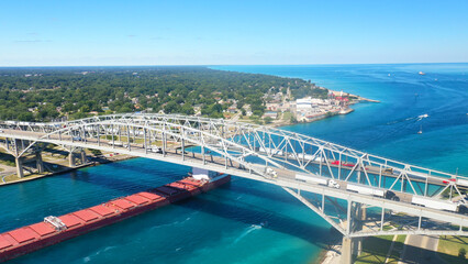 Aerial of the Blue Water Bridge and Lake Freighter in Sarnia, Canada