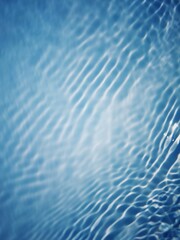Defocus blurred transparent blue colored clear calm water surface texture with splashes and bubbles. Trendy abstract nature background. Water waves in sunlight with copy space. Blue watercolor shining