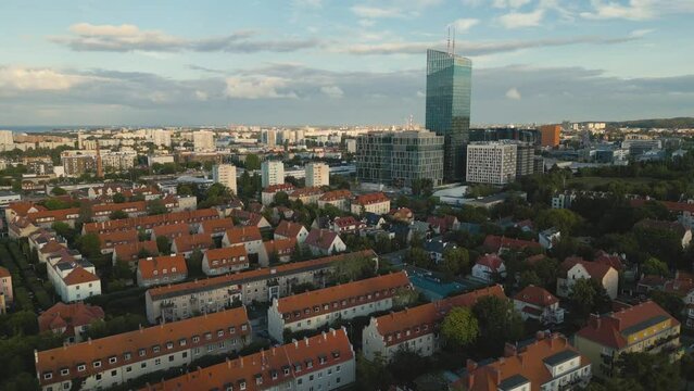  Aerial view of Gdansk. Flight over Oliwa district towards Olivia Business Center during day. Poland.