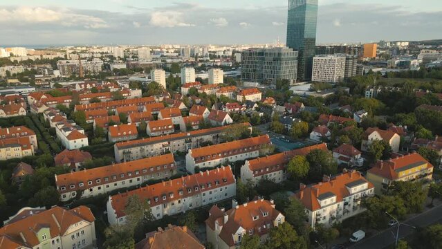  Aerial view of Gdansk. Flight over Oliwa district towards Olivia Business Center during day. Poland.