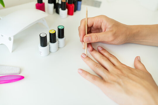 Covering your nails with gel polish at home, your own master, clean the cuticles. Professional hand care, home spa.