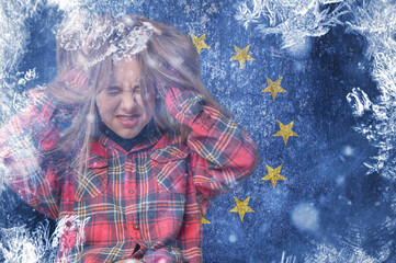 Teenage girl on a frozen background with the flag of the European Union. The concept of the crisis...