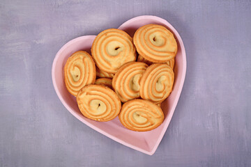 Round ring shaped spritz biscuits called 'Spritzgeback', a type of German butter cookies