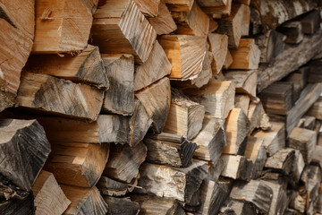firewood stacked in the woodpile, textured firewood background of chopped wood