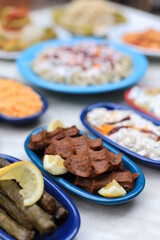 Meze or mezze is a selection of small dishes served as appetizers in much of West Asia, Middle East, and the Balkans. Meze is often served as a part of multi-course meals.