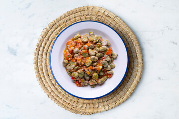 Beans with ham. Typical Spanish tapas recipe.